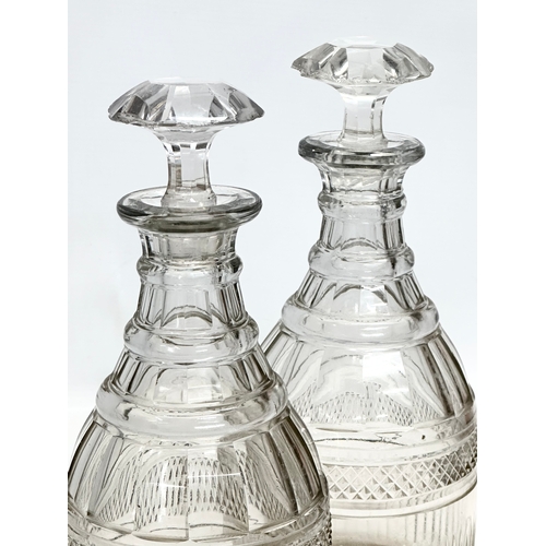 110 - A pair of large 19th Century Victorian glass decanters. 28cm