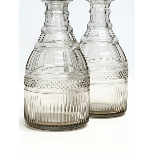 110 - A pair of large 19th Century Victorian glass decanters. 28cm