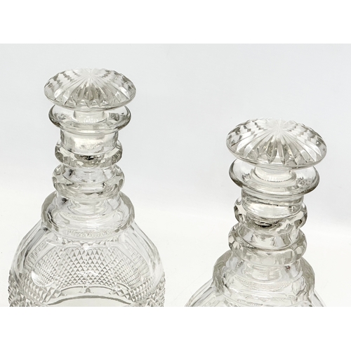 109 - A pair of large 19th Century Late Georgian Irish 3 ring decanters. Circa 1820-1830. 27cm.