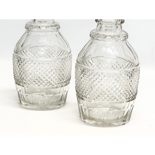 109 - A pair of large 19th Century Late Georgian Irish 3 ring decanters. Circa 1820-1830. 27cm.