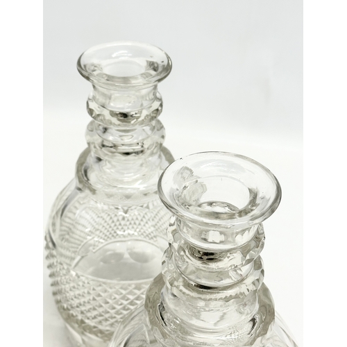 109 - A pair of large 19th Century Late Georgian Irish 3 ring decanters. Circa 1820-1830. 27cm.