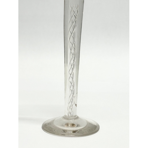 108 - A tall Late 19th Century Victorian twist stem wine glass. In the Georgian style. 22cm.