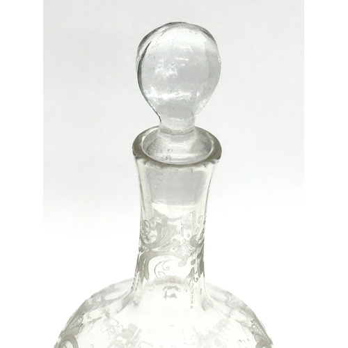 107 - A 19th Century Victorian etched glass decanter. 23cm