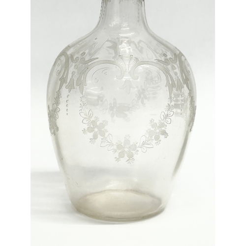 107 - A 19th Century Victorian etched glass decanter. 23cm