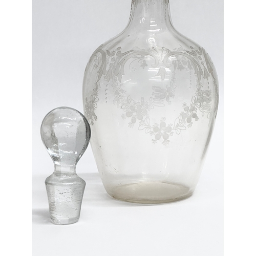 107 - A 19th Century Victorian etched glass decanter. 23cm