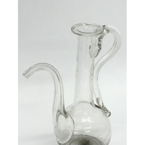 106 - An 18th Century hand blown glass oil bottle. George III. Circa 1780. 11x16cm