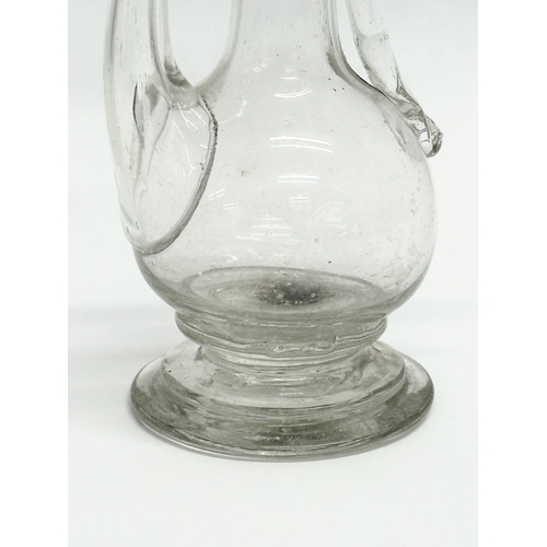 106 - An 18th Century hand blown glass oil bottle. George III. Circa 1780. 11x16cm