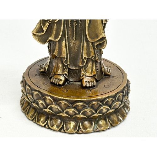 67 - A Chinese bronze 3 body Guanyin Buddha statue. Raised on a lotus leaf base. 4 character mark. 25cm