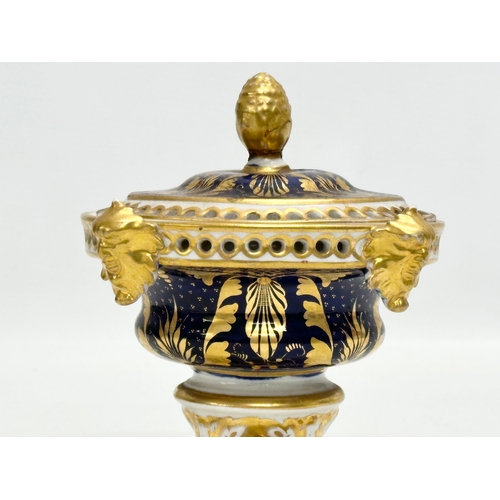 84 - Early Crown Derby. An Early 19th Century gilt potpourri pot with cover. With acorn handle, mask rims... 