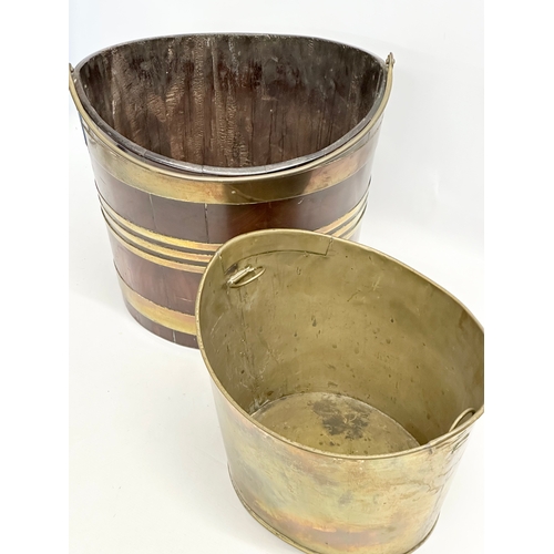 27 - A Late 18th Century George III mahogany and brass bound peat bucket, with original brass liner. Circ... 