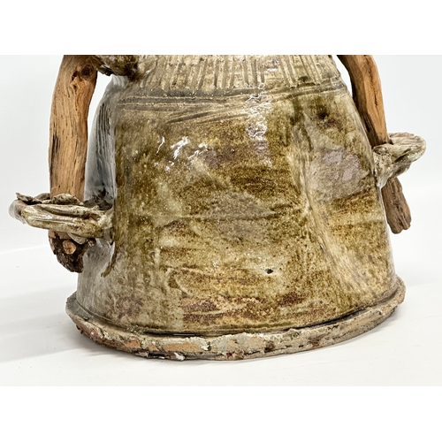 71 - Iga Ware. A large Late 20th Century Japanese glazed pot, with 2 wooden branch and 4 rings handles. 3... 