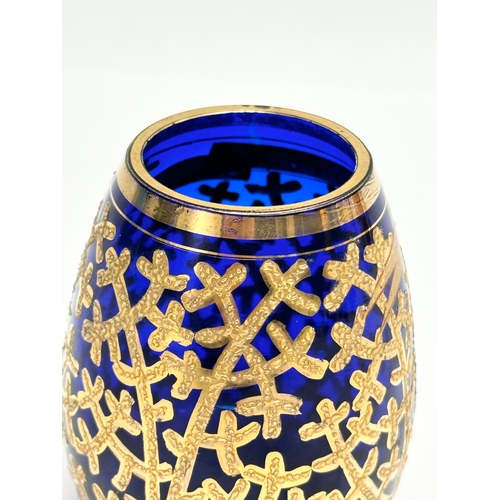 133 - A small Early/Mid 20th Century German gilt enamel bound cobalt blue glass vase. Drachenfels. 6x8cm