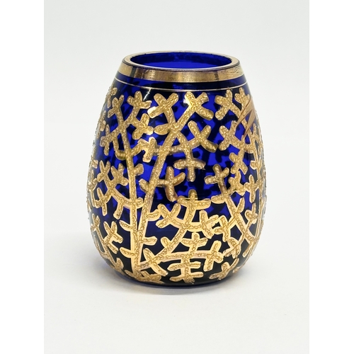 133 - A small Early/Mid 20th Century German gilt enamel bound cobalt blue glass vase. Drachenfels. 6x8cm