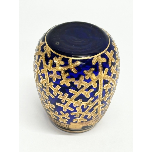 133 - A small Early/Mid 20th Century German gilt enamel bound cobalt blue glass vase. Drachenfels. 6x8cm