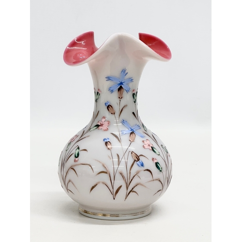 134 - A Late 19th Century hand painted enamel opaline glass vase, with pink interior and ripple curved rim... 