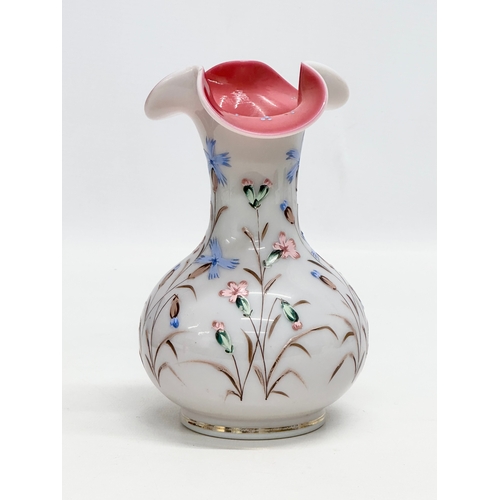 134 - A Late 19th Century hand painted enamel opaline glass vase, with pink interior and ripple curved rim... 