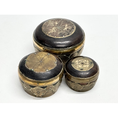 69 - A set of three 19th Century Indian brass bound ceremonial bowls. Raj Period (1858-1914). 11x8cm. 9x7... 