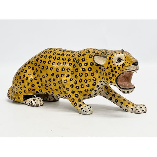 73 - A pair of 20th Century Indian painted wooden leopards. 26cm