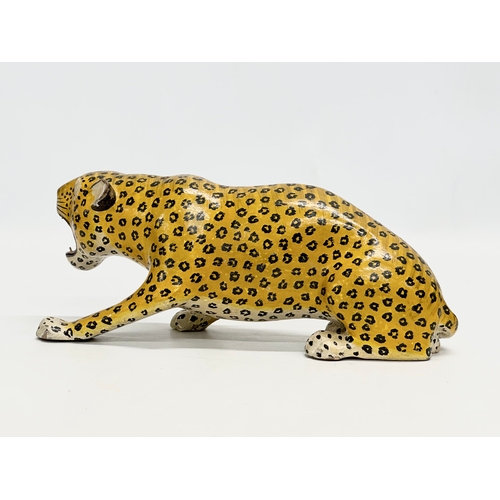 73 - A pair of 20th Century Indian painted wooden leopards. 26cm