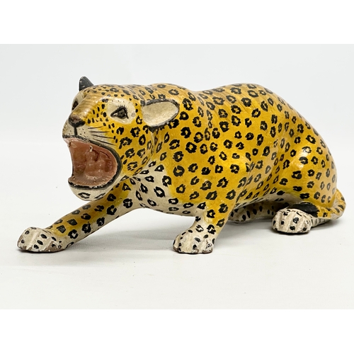 73 - A pair of 20th Century Indian painted wooden leopards. 26cm