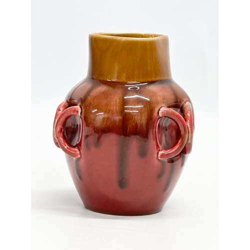 137 - A small Chinese Late 19th Century flambé and café-au-lait glazed, 3 handle drip pot. 9x9x12cm.