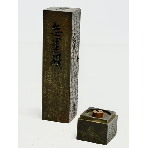 181 - A Chinese bronze stick incense burner. 13.5cm