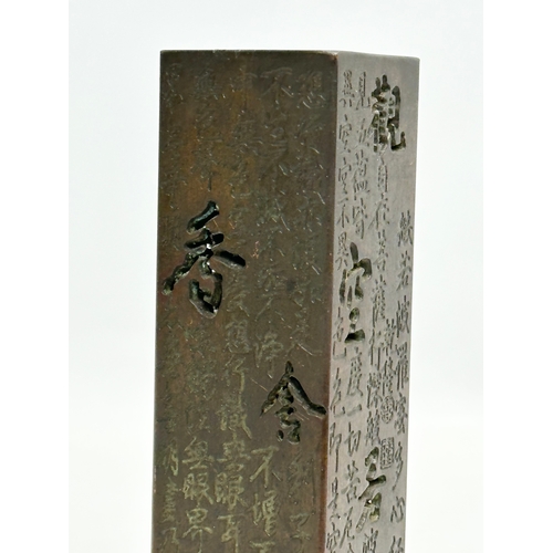 181 - A Chinese bronze stick incense burner. 13.5cm