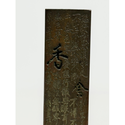 181 - A Chinese bronze stick incense burner. 13.5cm