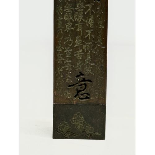 181 - A Chinese bronze stick incense burner. 13.5cm