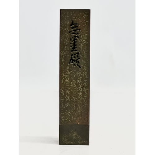 181 - A Chinese bronze stick incense burner. 13.5cm