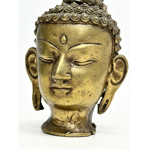 75 - An 18th/Early 19th Century Sino-Tibetan bronze Buddha head. 16cm