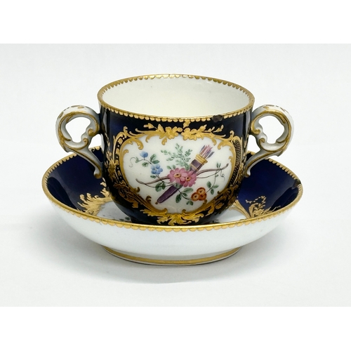 96 - A 19th Century Sevres hand painted chocolate cup and saucer.