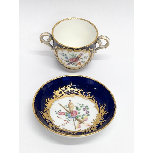 96 - A 19th Century Sevres hand painted chocolate cup and saucer.