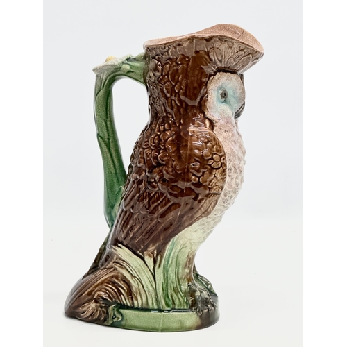 139 - A Late 19th Century Majolica owl pitcher. 26x29cm