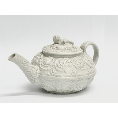 98 - An Early 19th Century Wedgwood Drabware, moulded relief teapot. George IV. Circa 1820-1830. 17x9x10c... 