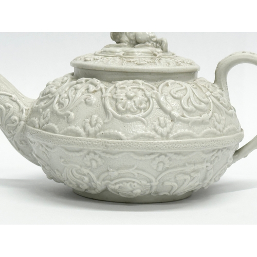 98 - An Early 19th Century Wedgwood Drabware, moulded relief teapot. George IV. Circa 1820-1830. 17x9x10c... 