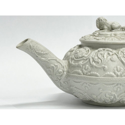 98 - An Early 19th Century Wedgwood Drabware, moulded relief teapot. George IV. Circa 1820-1830. 17x9x10c... 