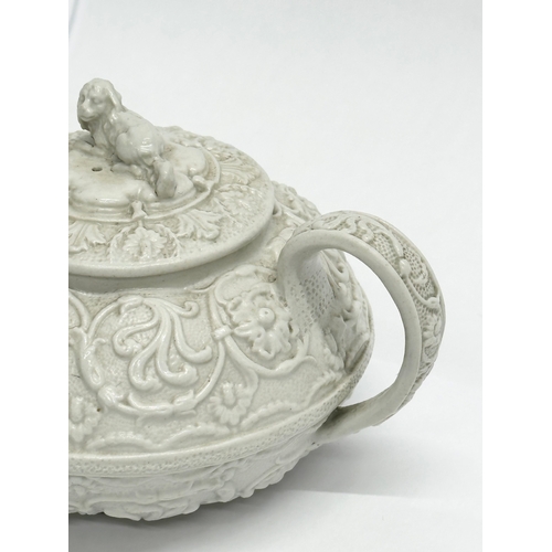 98 - An Early 19th Century Wedgwood Drabware, moulded relief teapot. George IV. Circa 1820-1830. 17x9x10c... 