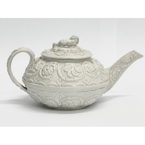 98 - An Early 19th Century Wedgwood Drabware, moulded relief teapot. George IV. Circa 1820-1830. 17x9x10c... 