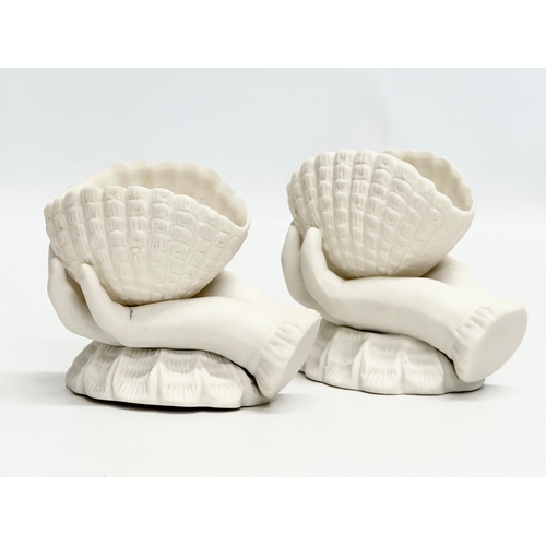 203 - A pair of Late 19th Century Victorian parian hand and shell bowls. 11x6.5x9.5cm