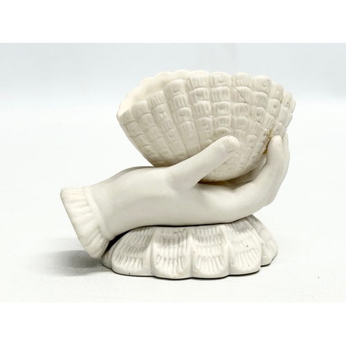 203 - A pair of Late 19th Century Victorian parian hand and shell bowls. 11x6.5x9.5cm