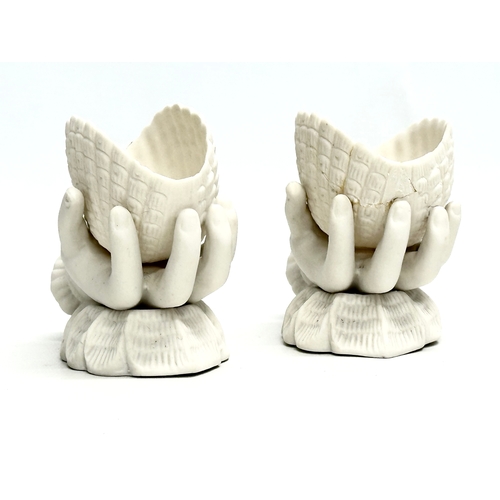 203 - A pair of Late 19th Century Victorian parian hand and shell bowls. 11x6.5x9.5cm