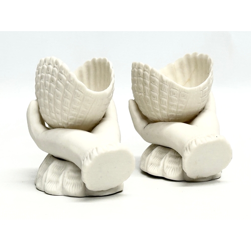 203 - A pair of Late 19th Century Victorian parian hand and shell bowls. 11x6.5x9.5cm