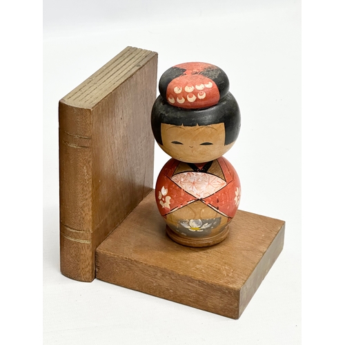 189 - A pair of Mid 20th Century Japanese Kokeshi doll bookends. Circa 1950. 13x10x13.5cm