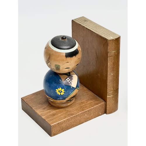 189 - A pair of Mid 20th Century Japanese Kokeshi doll bookends. Circa 1950. 13x10x13.5cm