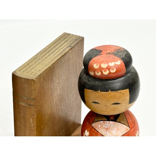 189 - A pair of Mid 20th Century Japanese Kokeshi doll bookends. Circa 1950. 13x10x13.5cm