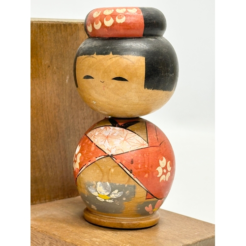 189 - A pair of Mid 20th Century Japanese Kokeshi doll bookends. Circa 1950. 13x10x13.5cm