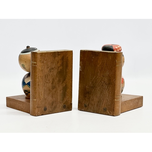 189 - A pair of Mid 20th Century Japanese Kokeshi doll bookends. Circa 1950. 13x10x13.5cm