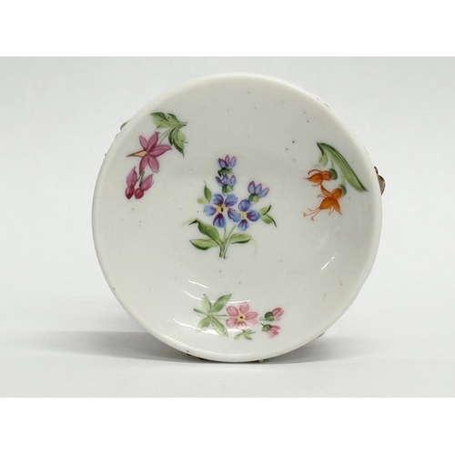 141 - Sitzendorf. A Late 19th/Early 20th Century German flower encrusted miniature cup and saucer, with pa... 