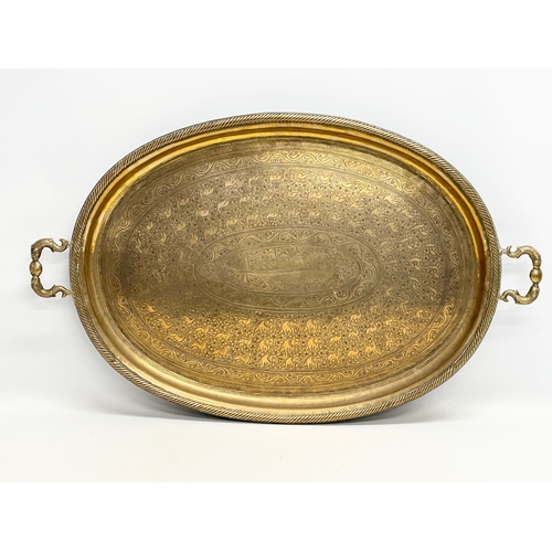 289 - A large Late 19th Century Indian style engraved brass tray. 77x44cm